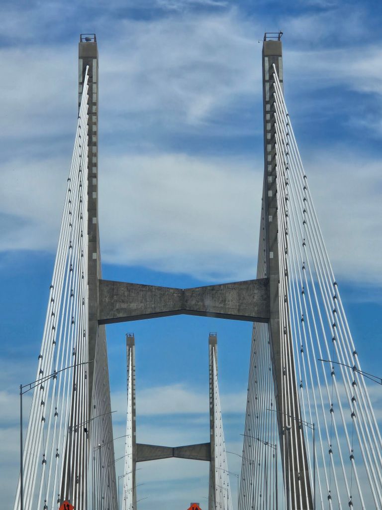 Cable-stayed bridge towers rising above the roadway