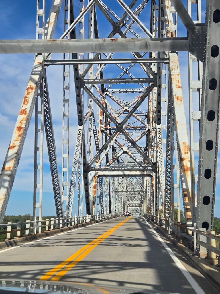 Overhead metal beams of a truss bridge