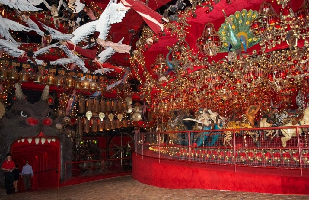 Elaborate red-and-gold carousel display with chandeliers and fantastical figures inside House on the Rock, Wisconsin