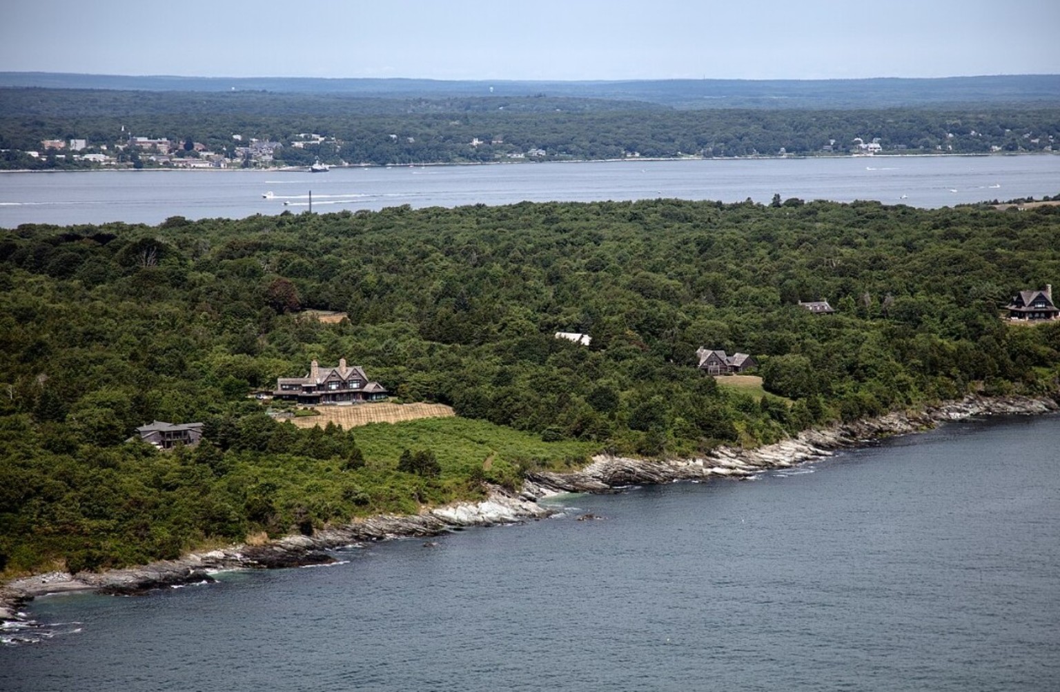 Aerial view of wooded Conanicut Island coastline and Narragansett Bay near Jamestown, Rhode Island.